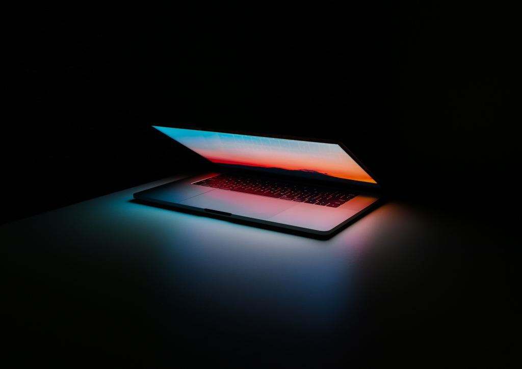 Decorative Image of a laptop in the dark. 